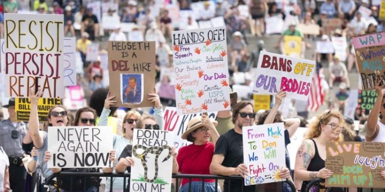 Federal judge partially blocks Trump’s effort to deny funding to pro-DEI public schools